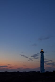 silhouette of a danish lighthouse at sunset