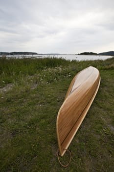 wooden canoe on the grass