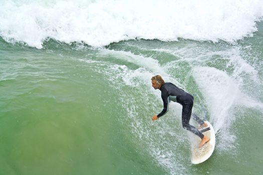 Surfer riding a wave with Copy Space