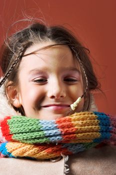 little pretty child with coat and scarf