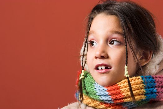 little pretty child with coat and scarf