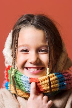 little pretty child with coat and scarf