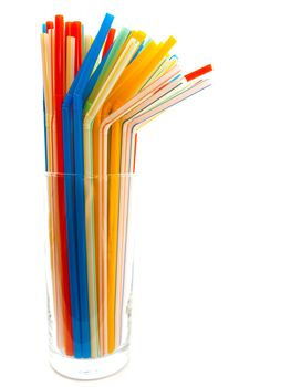 many multicolored tubules in glass against the white background