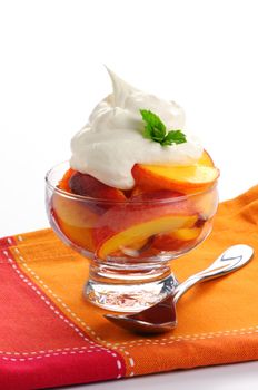 Fresh ripe sliced peaches with whipped cream.