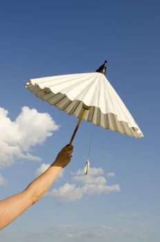 woman hand holding white paper umbrella