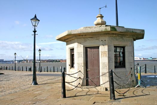 Small Stone Building Near Albert Dock Buildings in Liverpool England UK