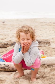 Having fun with sand on the beach.