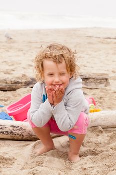 Having fun with sand on the beach.