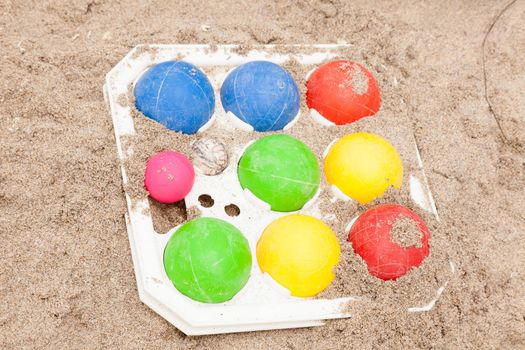 Colorful set of the bocce balls on sand.