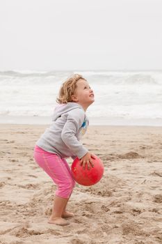 Having fun with sand on the beach.