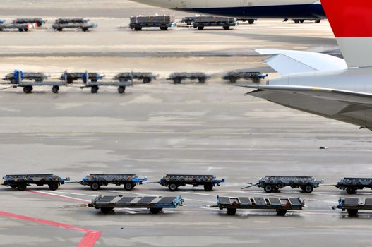 Cargo loading equipment at international airport ramp.