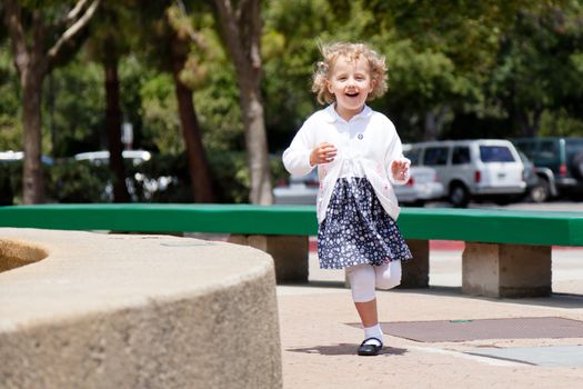 Having fun running around the fountain in the park.