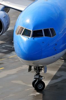 Air transportation: Close-up of a passenger airliner approaching the gate.