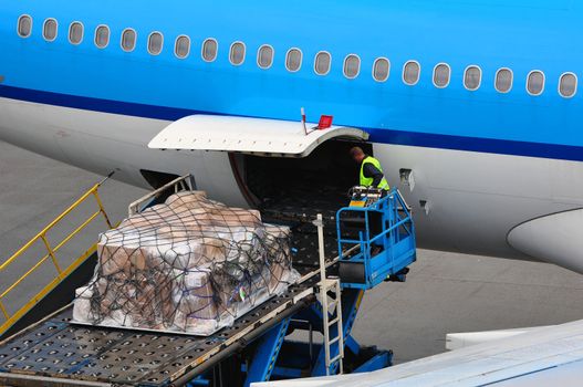 Air transportation: airplane loading cargo