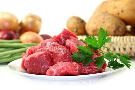 raw beef stew with lovage, potatoes and green beans