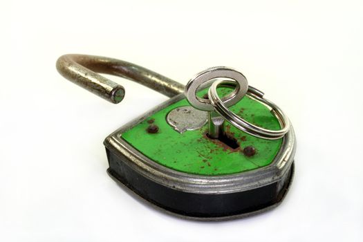 old padlock with key on a white background