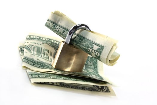 Padlock with dollar bills in front of white background