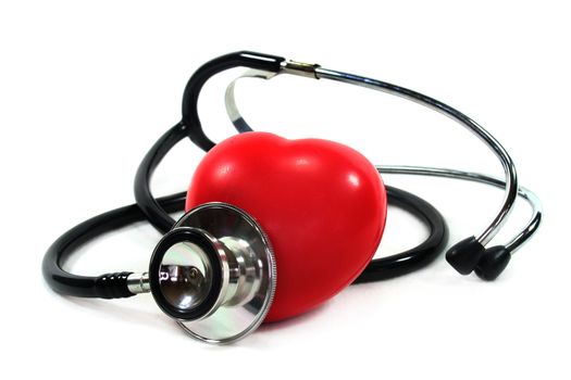 Stethoscope with heart on white background