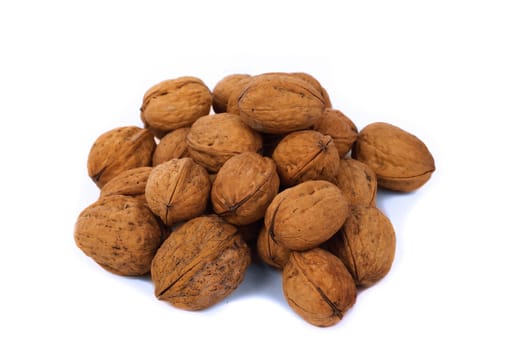 Pile of walnuts, isolated over white background