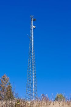 Metal tower with antennas for cell phone telecommunications.
