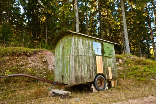 Small old lunch shelter on wheels for forestry workers.