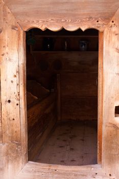 Door way to food cache on historic Black Forest farm, Germany.