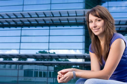 Pretty attractive caucasian girl sitting relaxing outside college school