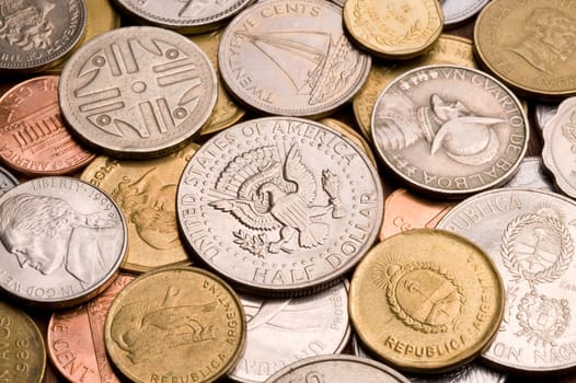 Background of assorted coins from different countries, close up.