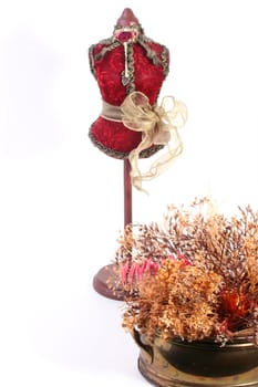 The decorative dummy for a house or boutique ornament, can be used for storage of pins and needles.