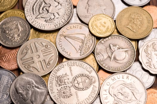 Background of assorted coins from different countries, close up.