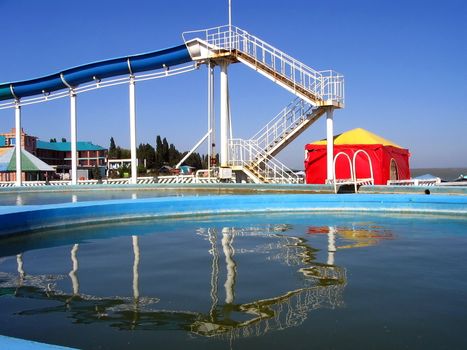 Swimming-pool and childrens  chute on seaside