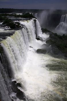 The Iguassu (or Iguazu) Falls is one of the largest masses of fresh water on the planet and divides, in South America, Brazil, Paraguay and Argentina. The waterfall system consists of 275 falls along 2.7 kilometres (1.67 miles) of the Iguazu River. Some of the individual falls are up to 82 metres (269 feet) in height, though the majority are about 64 metres (210 feet).