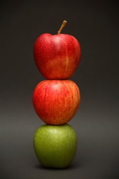 A line of apples with one exception.