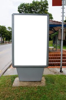 Blank billboard display at bus stop with clipping path for your advertising