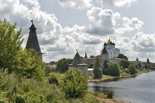 Ancient russian Pskov fortress view with towers and church