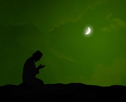 muslim praying at night under the moon