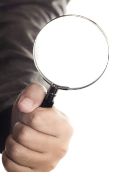 magnifying glass in hand over white background