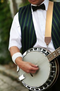 entertained banjo player is doing his job