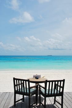 beautiful photo of a tropical view at a beach bar in a maldivian island