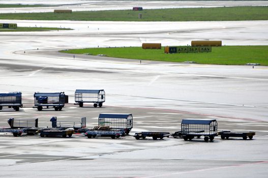 Cargo loading equipment at international airport ramp.