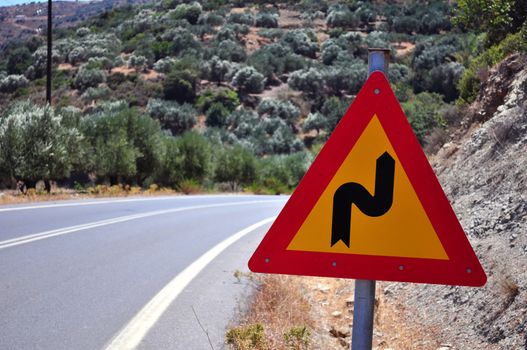 Mountain road curve sign