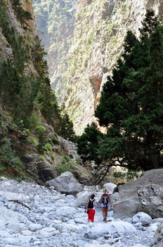 Travel photography: Samaria National Park, Crete. Two girls hiking towards the 

gorge.