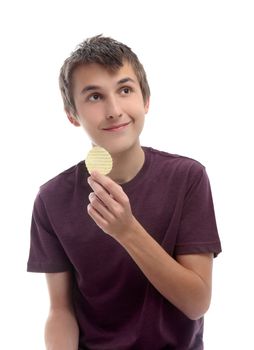 A boy holding a single potato crisp chip and looking sideways at your message.  White background.