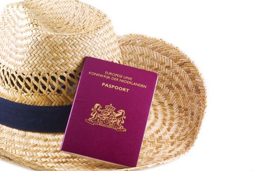 Straw hat with passport, isolated on a white background.