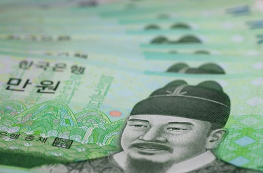 A close-up of several Korean 10,000 Won banknotes
