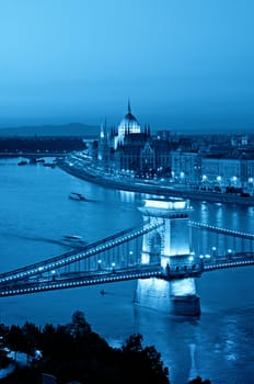 Color toned image of Budapest skyline at night. (This view includes: Chain Bridge, Hungarian Parliament and River Danube )