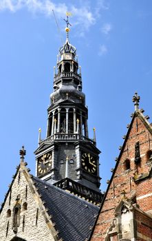 Oude kerk, details of bell tower in Amsterdam city.