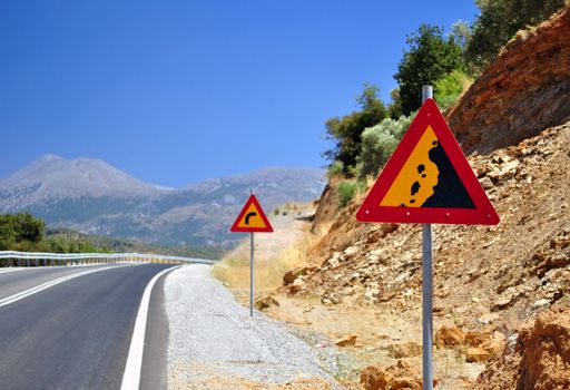 Falling rocks road sign in the mountains of Crete.