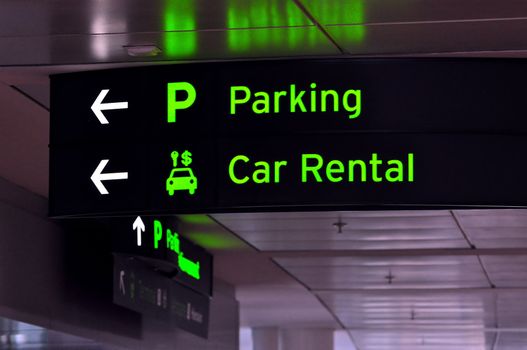 Parking and car rental sign at international airport