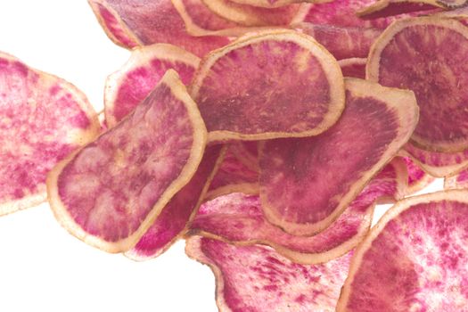 Isolated macro image of sweet potato chips.